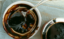 Sugarcane molasses in a container